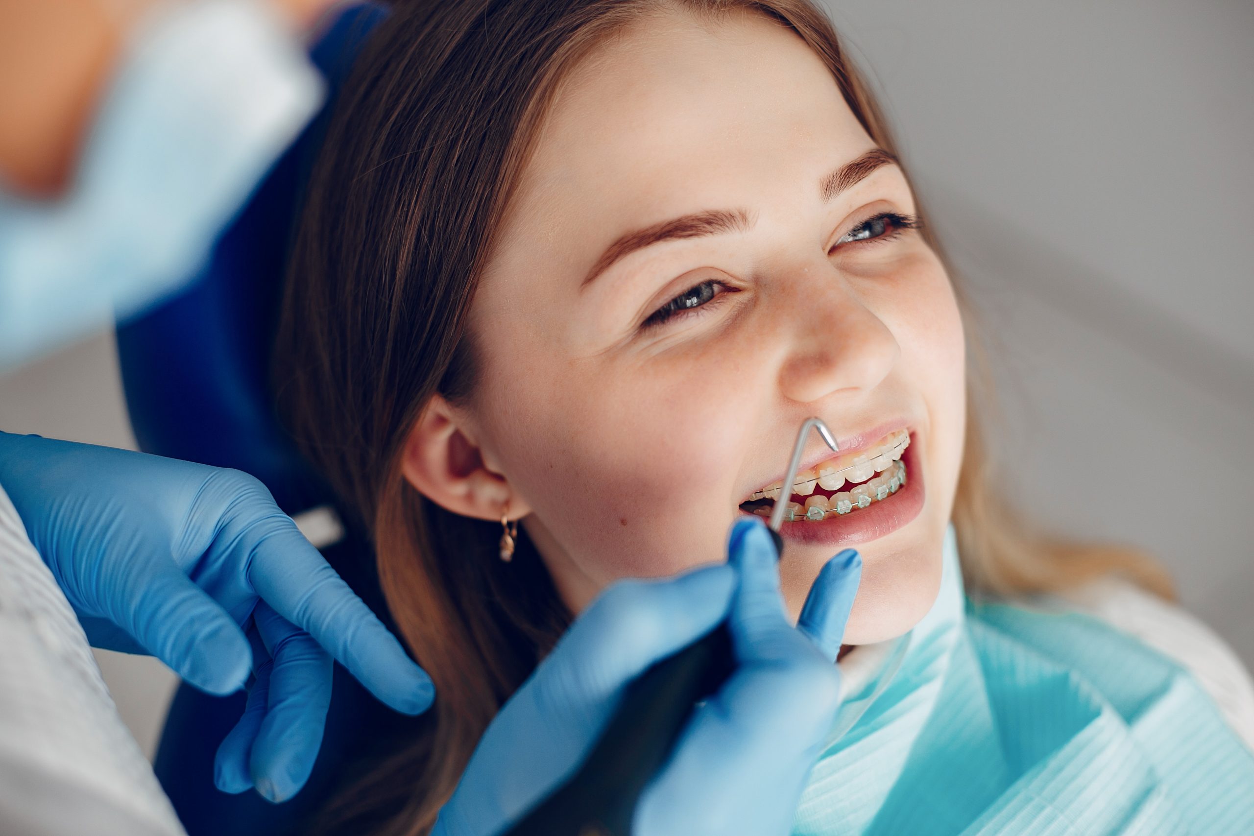 Beautiful lady in the dentist's office. Woman in a uniform